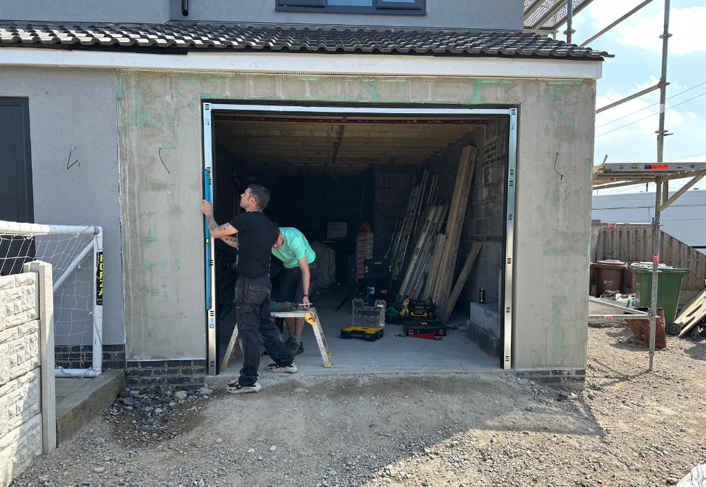 men working in a garage door pontefract
